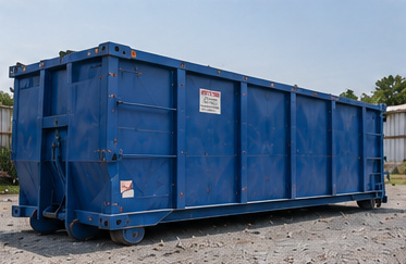 A blue roll-off dumpster standing in a gravel rental yard